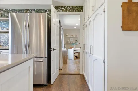 a bedroom with a bed and a mirror