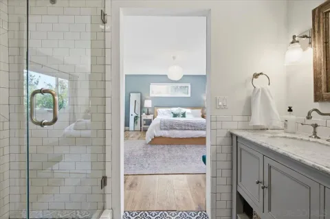 a bedroom that has a bed and a desk in it