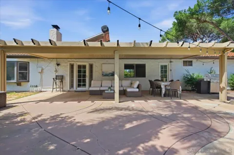 a view of a yard with an outdoor seating