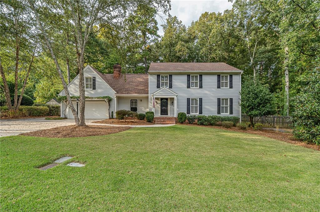 202 Green View Road Southwest Rome, GA 30165 - Photo 1 of 1 a front view of a house with a garden