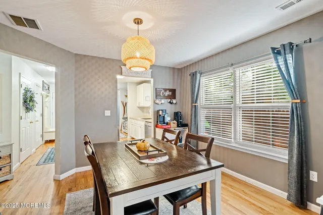 a view of a kitchen with furniture and a potted plant