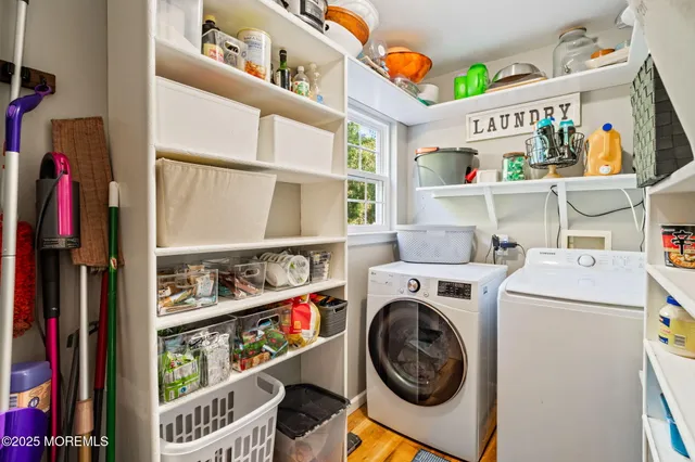 a bathroom with a toilet sink and shower curtain
