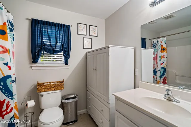 a view of a livingroom with furniture and staircase