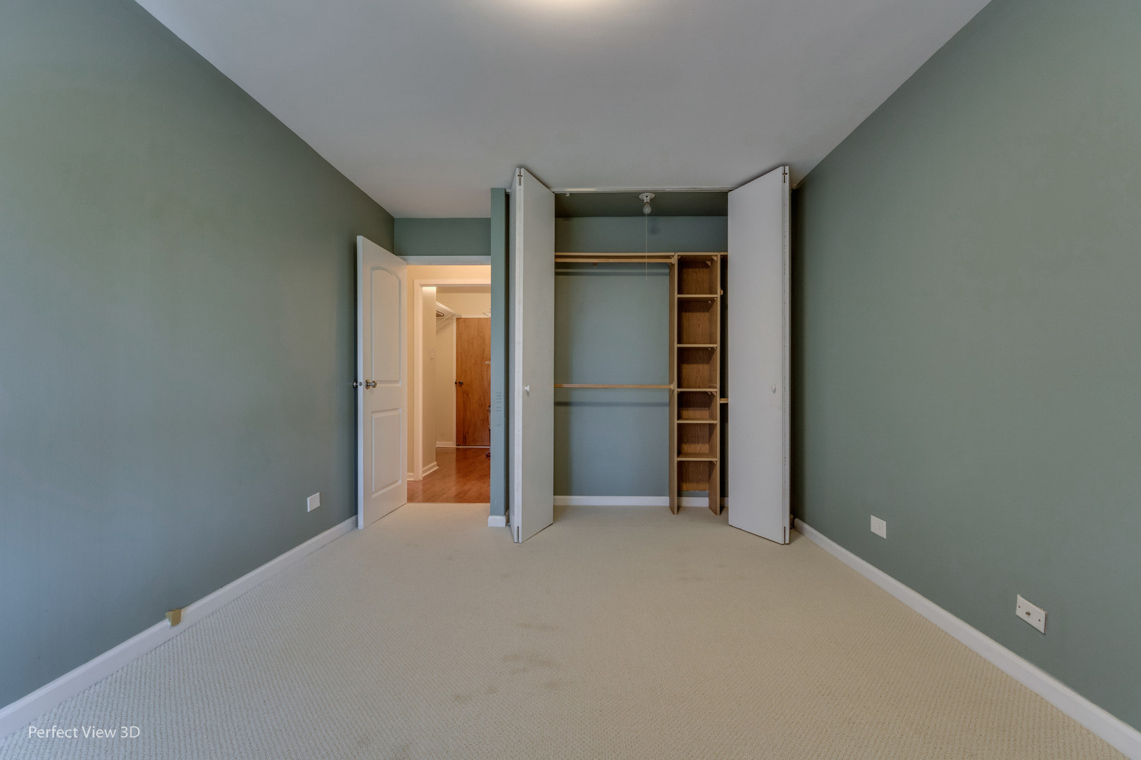 701 Forum Square, Unit 307 Glenview, IL 60025 - Photo 16 of 22 a view of an empty room with closet and wooden door