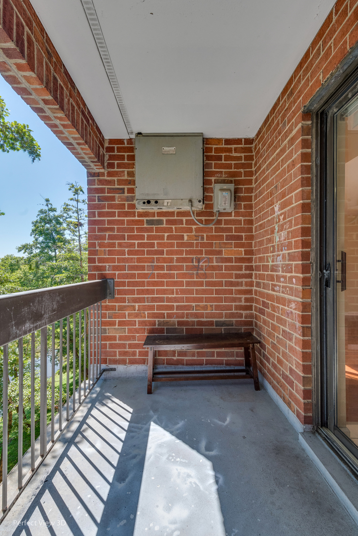 701 Forum Square, Unit 307 Glenview, IL 60025 - Photo 18 of 22 a view of a patio with wooden floor