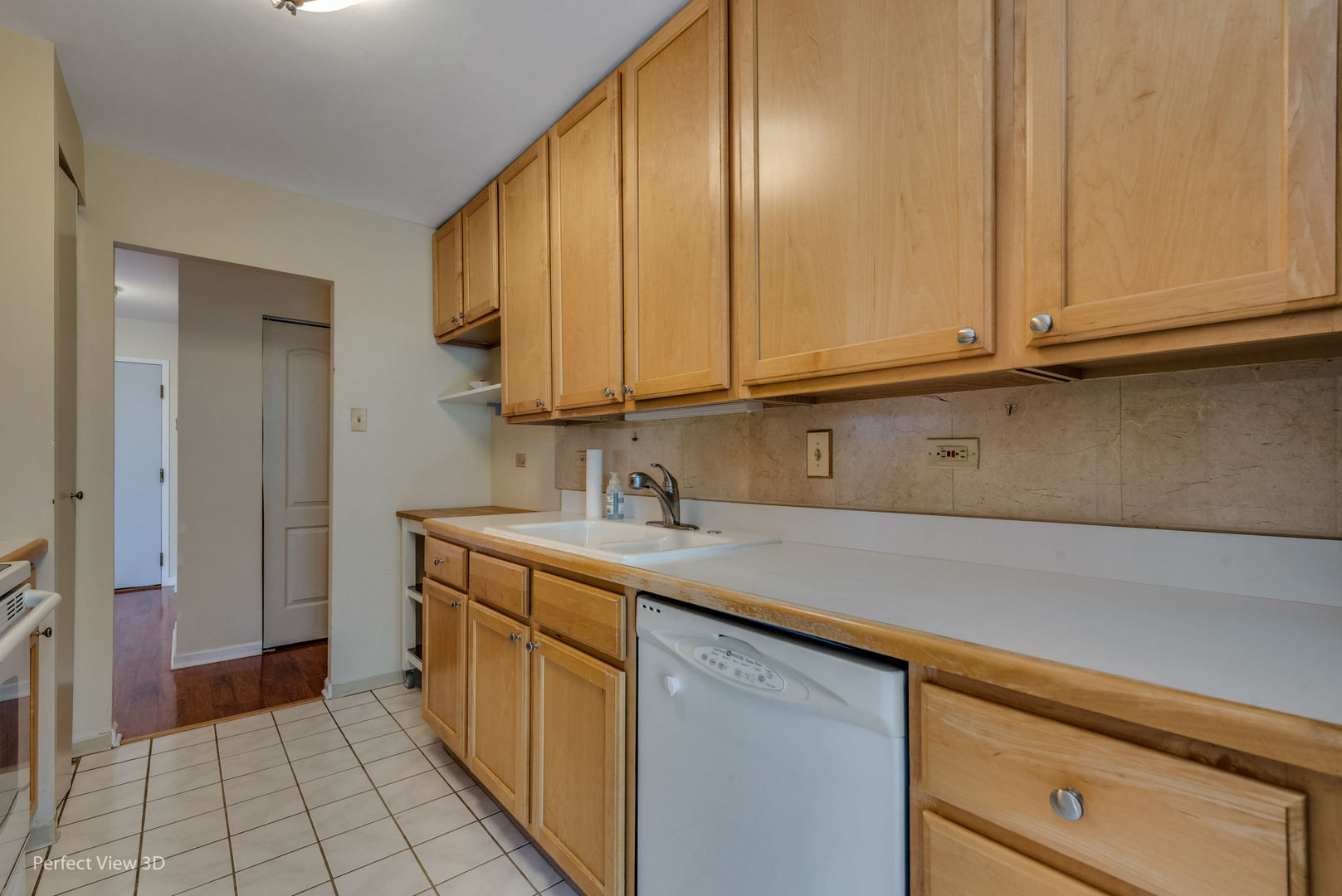 701 Forum Square, Unit 307 Glenview, IL 60025 - Photo 3 of 22 a kitchen with stainless steel appliances granite countertop a sink and dishwasher with white cabinets