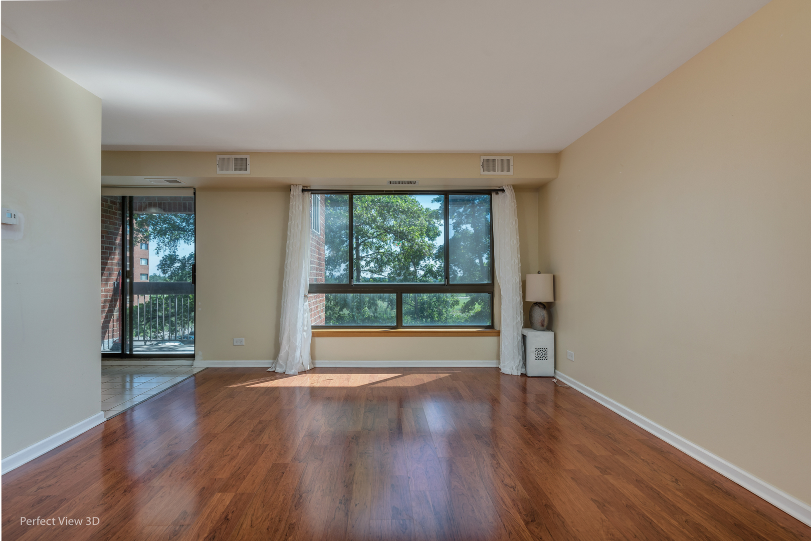 701 Forum Square, Unit 307 Glenview, IL 60025 - Photo 6 of 22 an empty room with wooden floor and windows