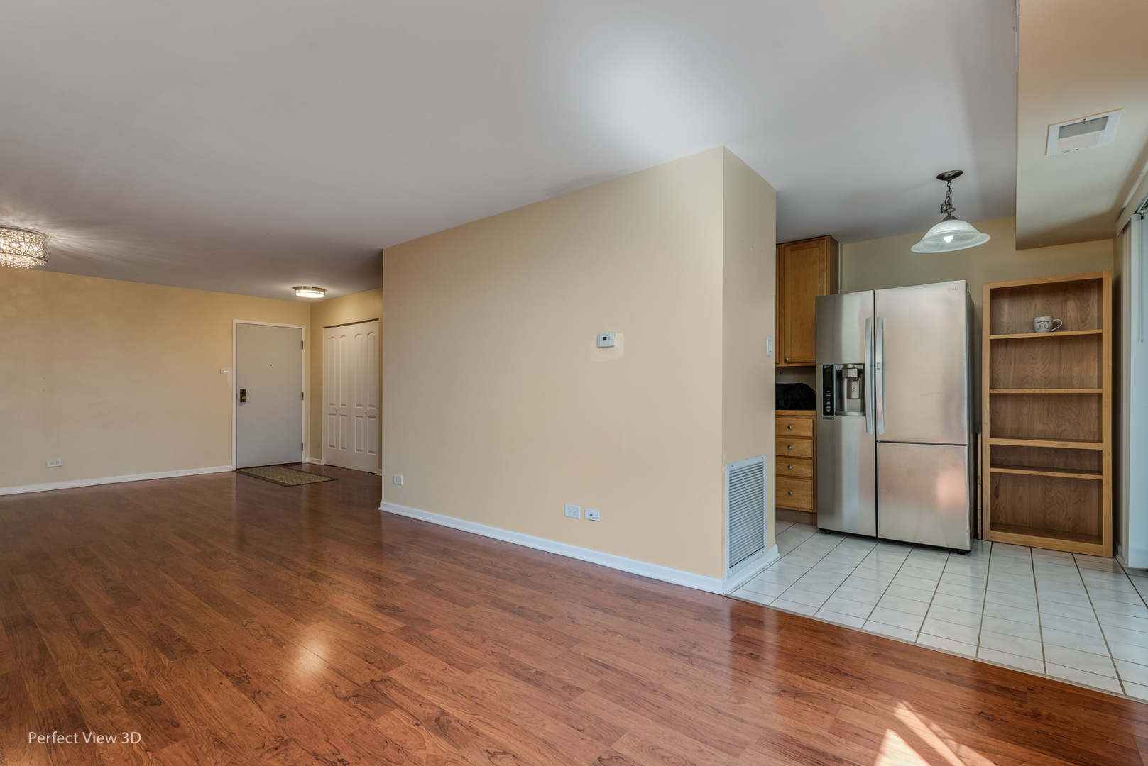 701 Forum Square, Unit 307 Glenview, IL 60025 - Photo 7 of 22 a view of a kitchen with a fridge and wooden floor