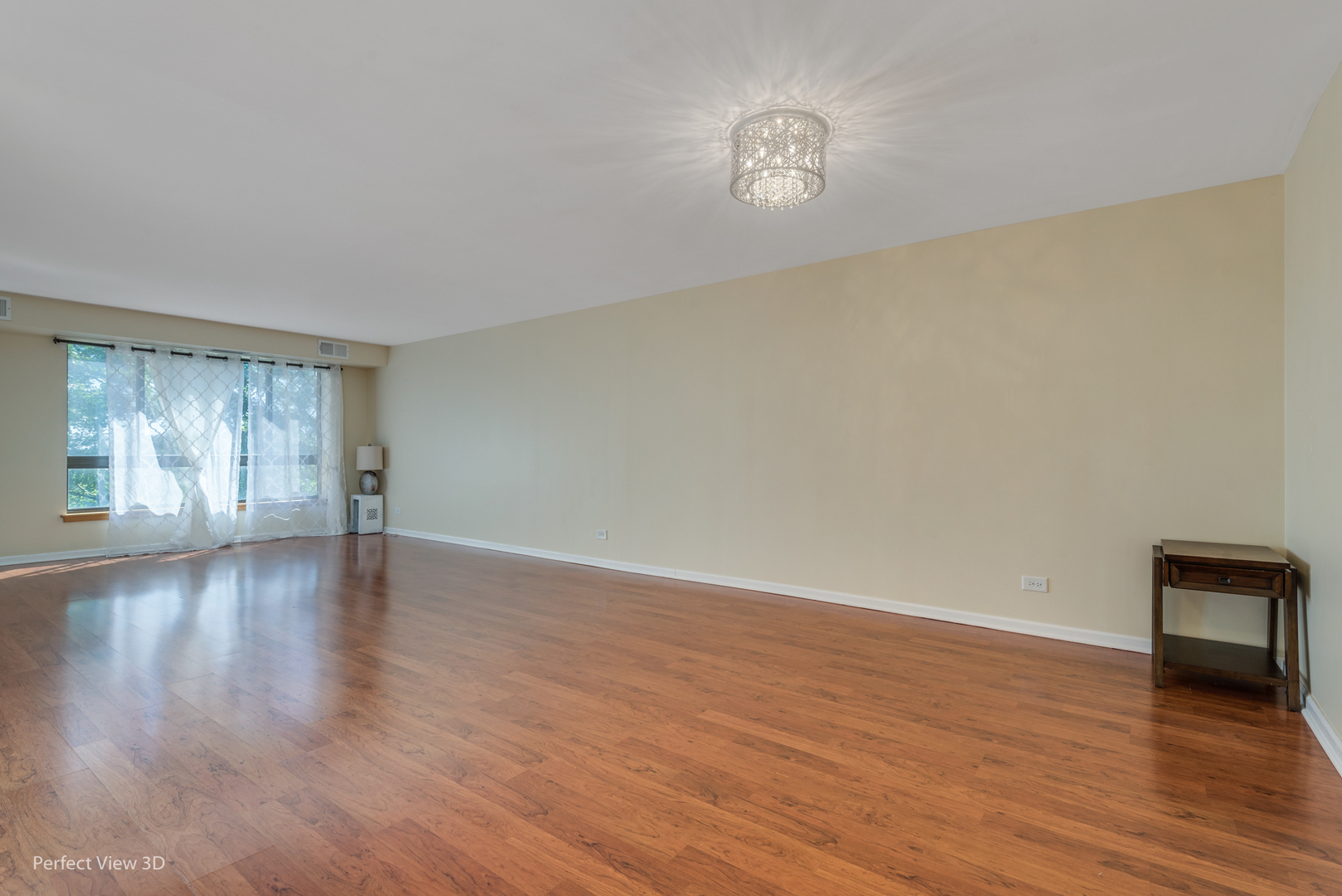 701 Forum Square, Unit 307 Glenview, IL 60025 - Photo 9 of 22 a view of an empty room with wooden floor and a window
