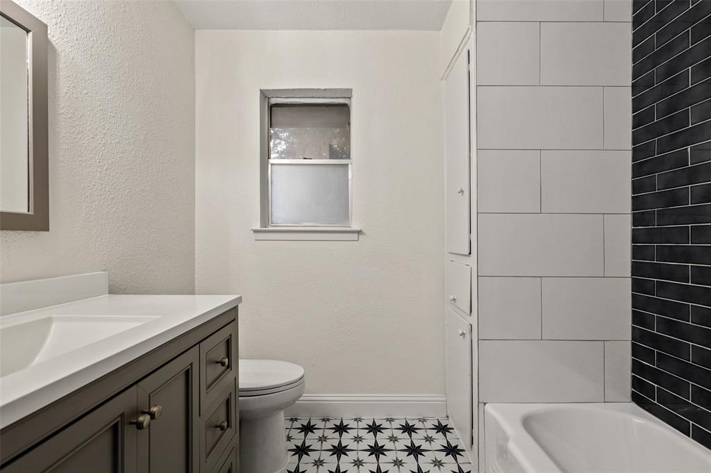 3126 Jubilee Trail Dallas, TX 75229 - Photo 25 of 38 a bathroom with a sink a toilet and shower
