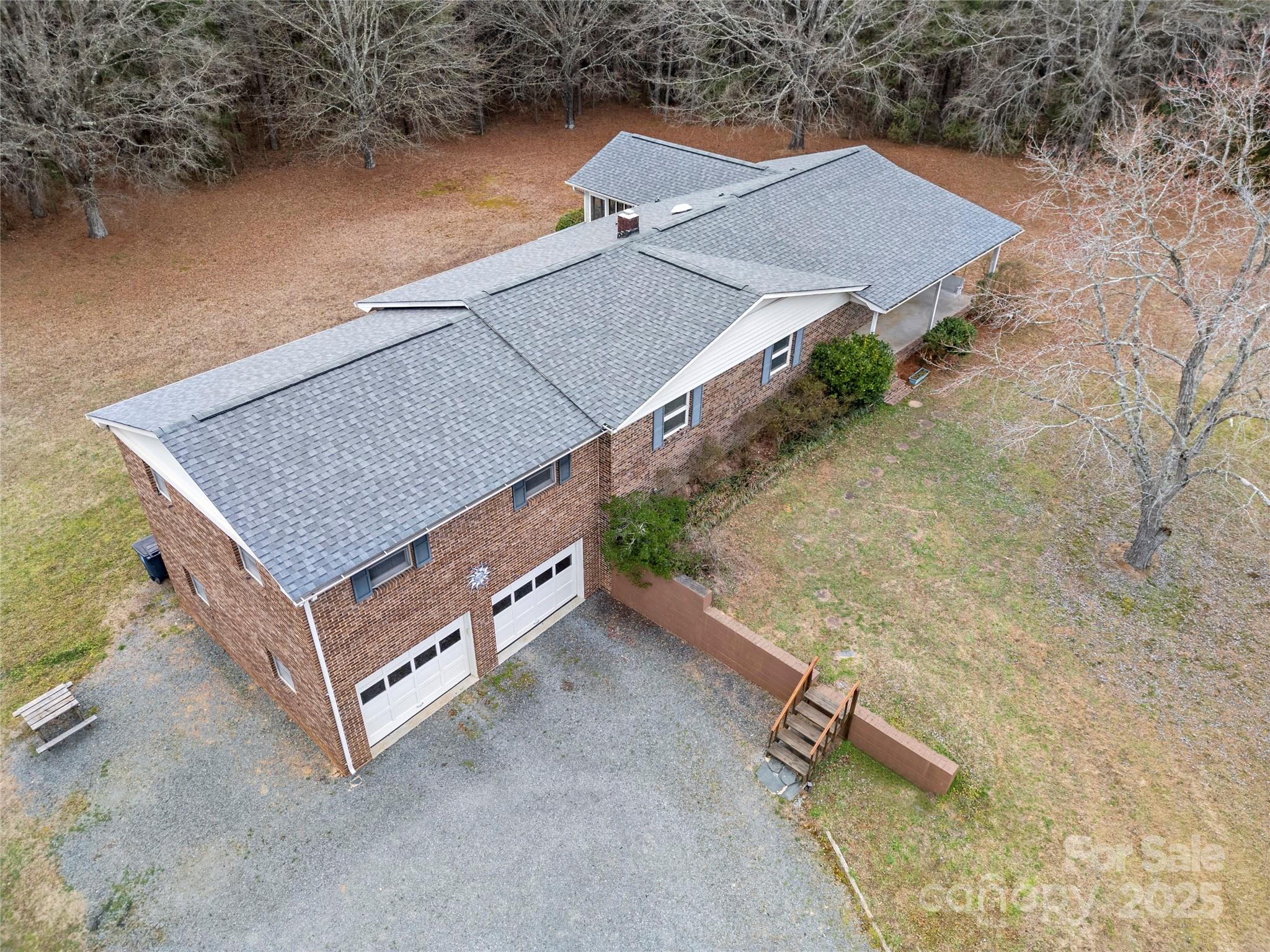 5303 Rogers Road Monroe, NC 28110 - Photo 12 of 45 an aerial view of a house with a yard and a terrace