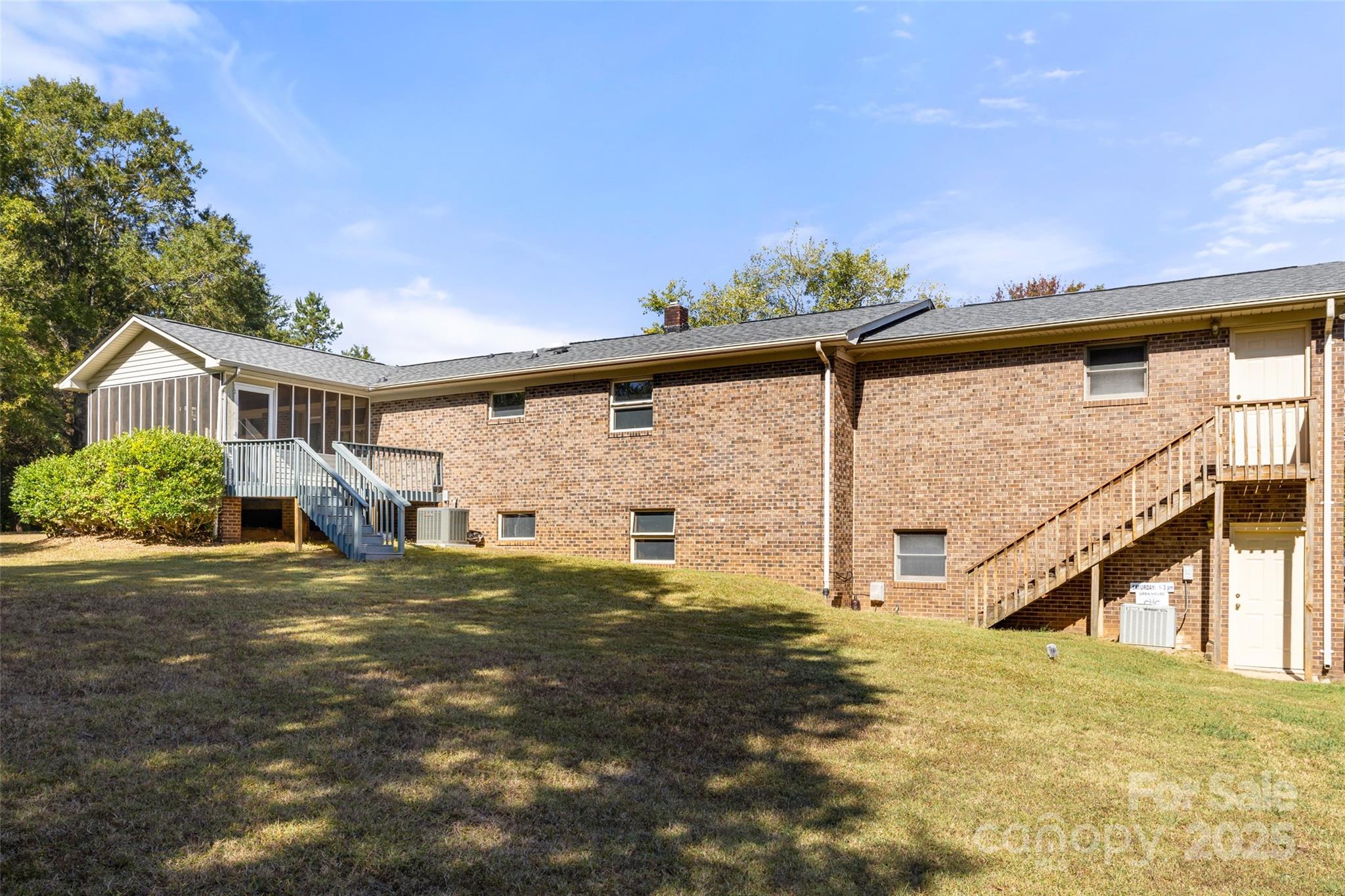 5303 Rogers Road Monroe, NC 28110 - Photo 14 of 45 a view of a house with a big yard and large tree