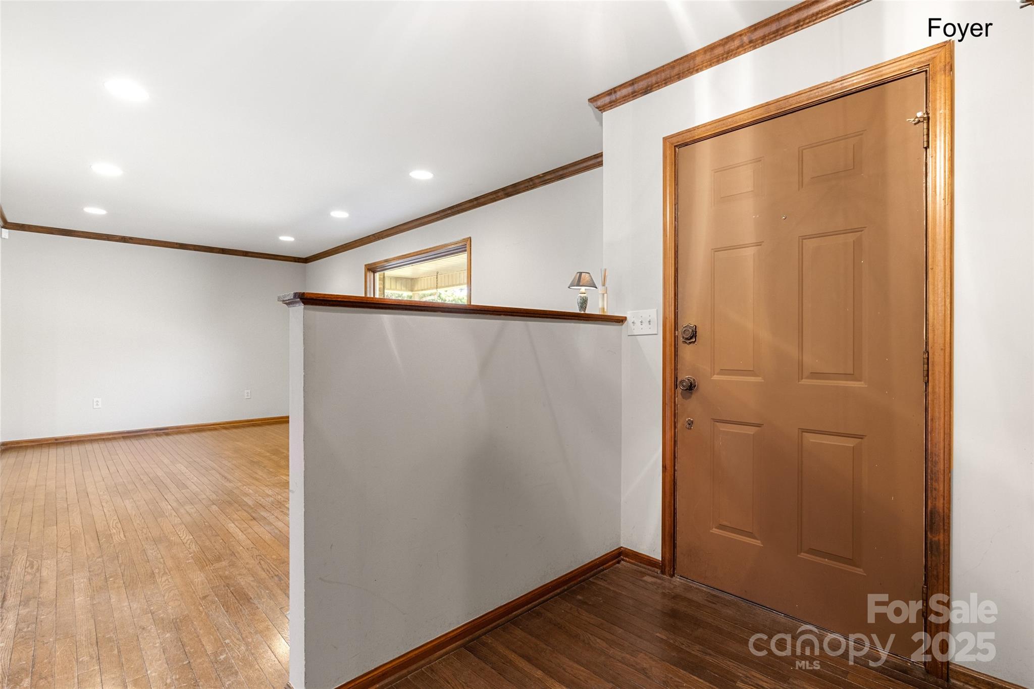 5303 Rogers Road Monroe, NC 28110 - Photo 17 of 45 a view of an empty room with wooden floor