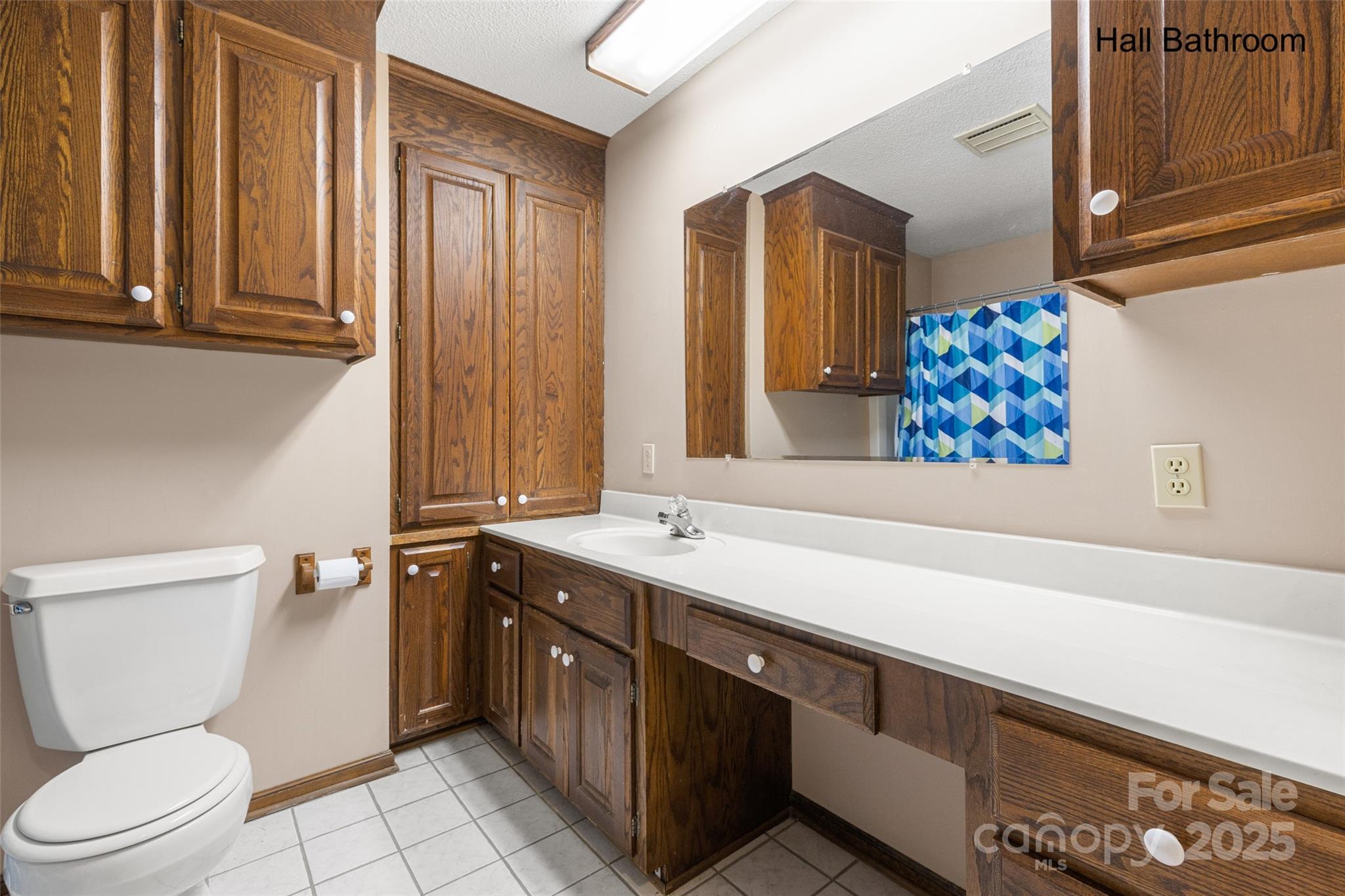 5303 Rogers Road Monroe, NC 28110 - Photo 18 of 45 a bathroom with a double vanity sink mirror and toilet