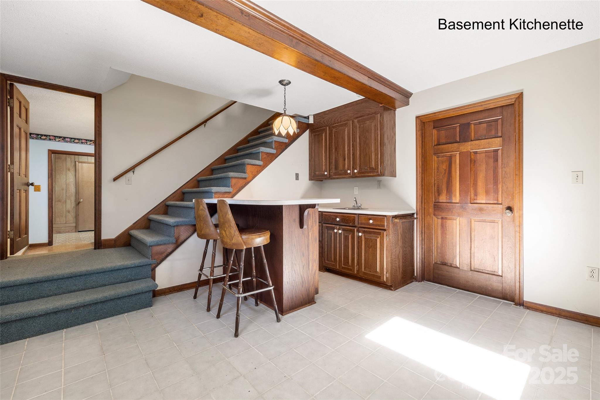 5303 Rogers Road Monroe, NC 28110 - Photo 19 of 45 a view of a kitchen with furniture and stairs