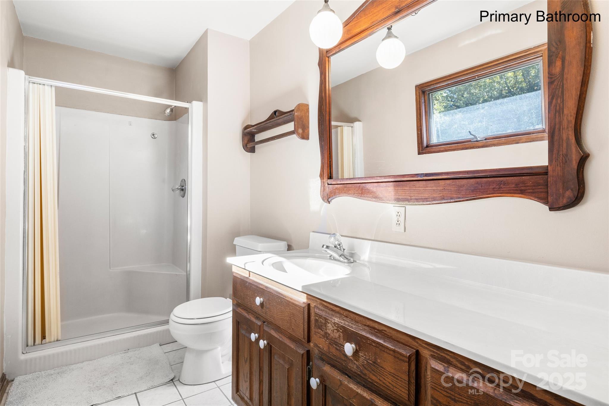 5303 Rogers Road Monroe, NC 28110 - Photo 23 of 45 a bathroom with a sink a toilet and shower