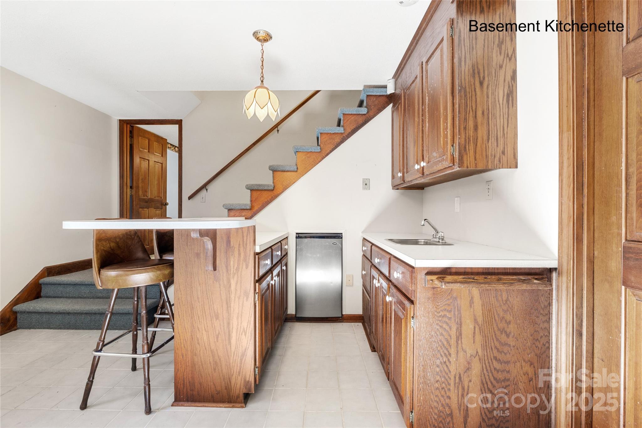 5303 Rogers Road Monroe, NC 28110 - Photo 29 of 45 a kitchen with furniture and a refrigerator