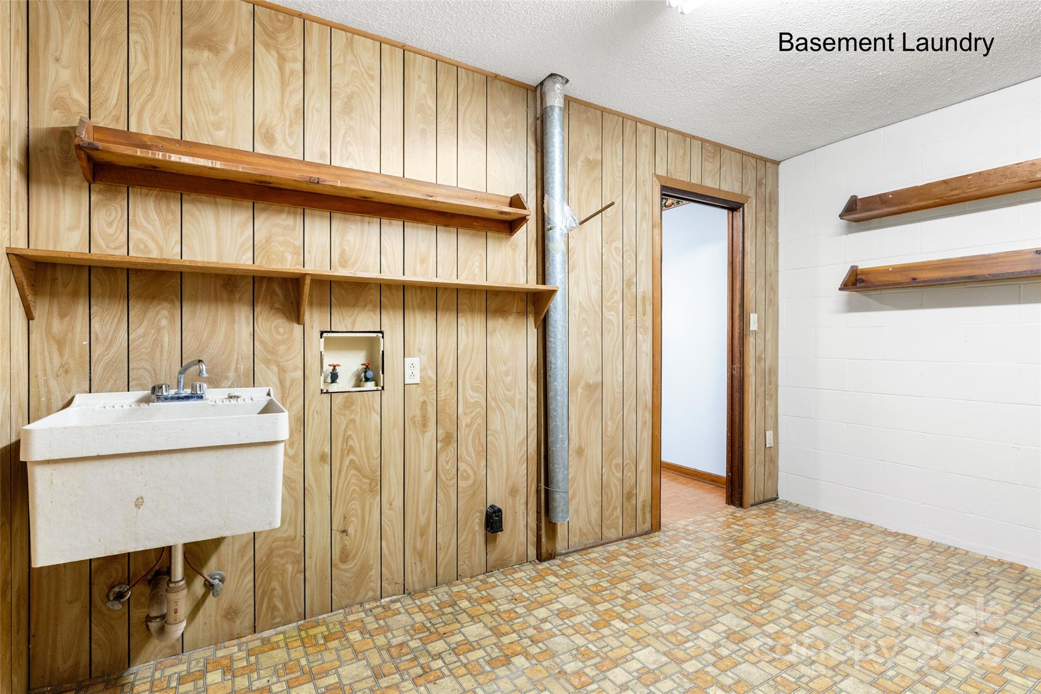 5303 Rogers Road Monroe, NC 28110 - Photo 32 of 45 a view of a bathroom with a sink and a window