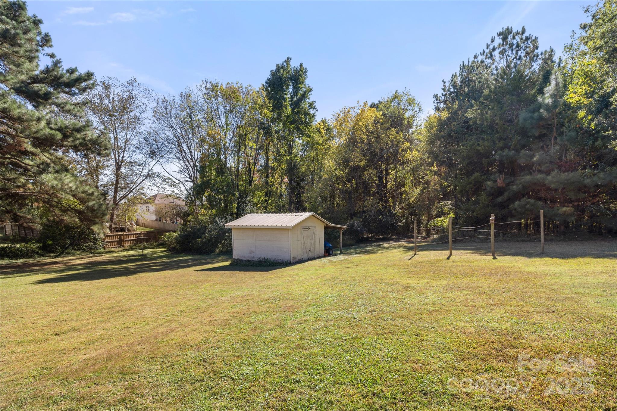 5303 Rogers Road Monroe, NC 28110 - Photo 37 of 45 a view of a swimming pool with an outdoor space and seating area