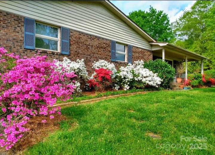 5303 Rogers Road Monroe, NC 28110 - Photo 44 of 45 a view of a house with a yard and garden