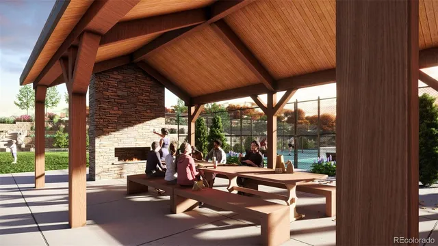 a view of a patio with a dining table and chairs