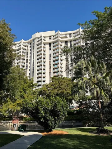 a view of a building with trees