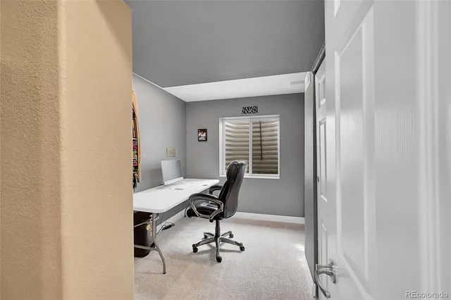 a view of a workspace with furniture