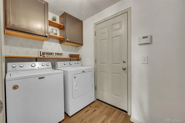 a view of a storage & utility room with washer and dryer