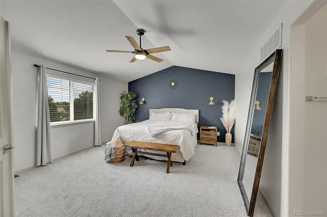 a bed room with a bed and a window