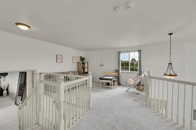 a bedroom with furniture and windows