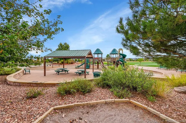 a view of a golf course with green space