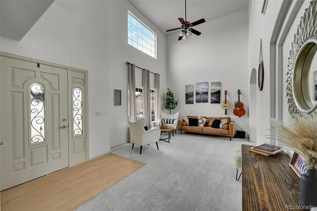 a view of a livingroom with furniture and windows