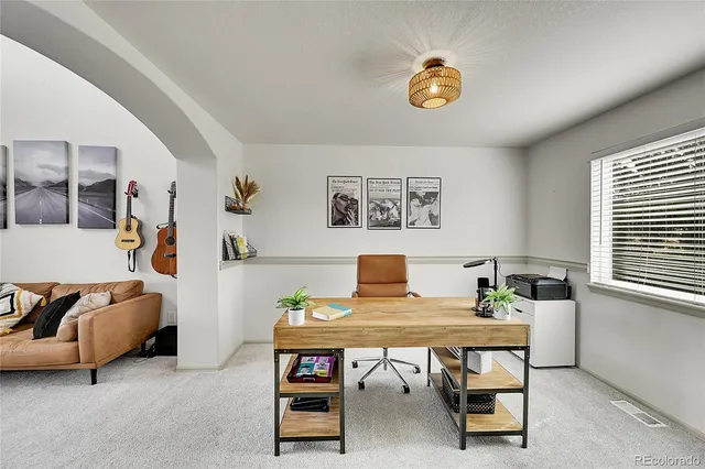 a workspace with furniture and window