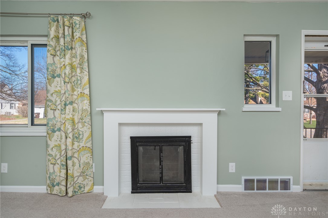 326 North Bromfield Road Kettering, OH 45429 - Photo 5 of 30 This inviting living space features a cozy fireplace, perfect for tranquil evenings.