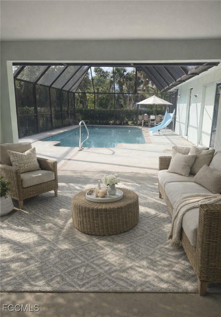 16320 Arbor Ridge Drive Fort Myers, FL 33908 - Photo 14 of 20 a living room with a couch and a large window