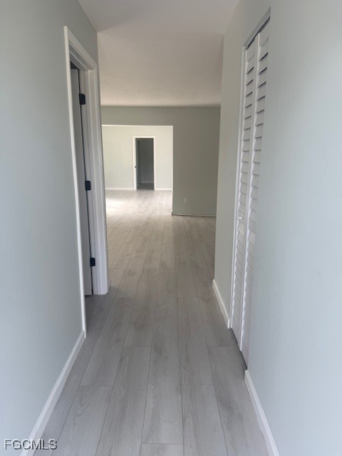 16320 Arbor Ridge Drive Fort Myers, FL 33908 - Photo 16 of 20 a view of a hallway with wooden floor