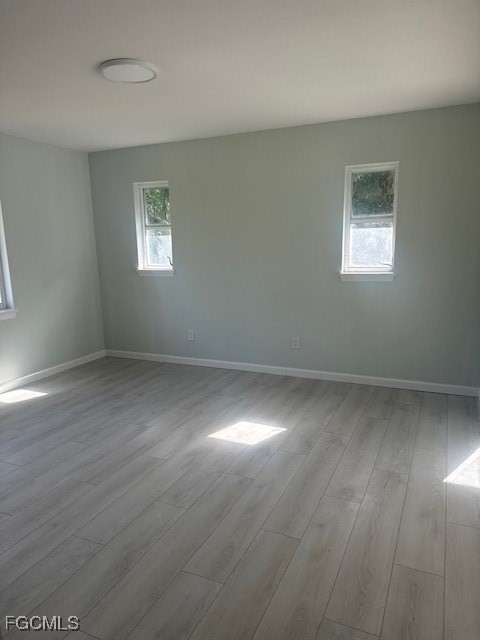 16320 Arbor Ridge Drive Fort Myers, FL 33908 - Photo 18 of 20 wooden floor in an empty room with a window