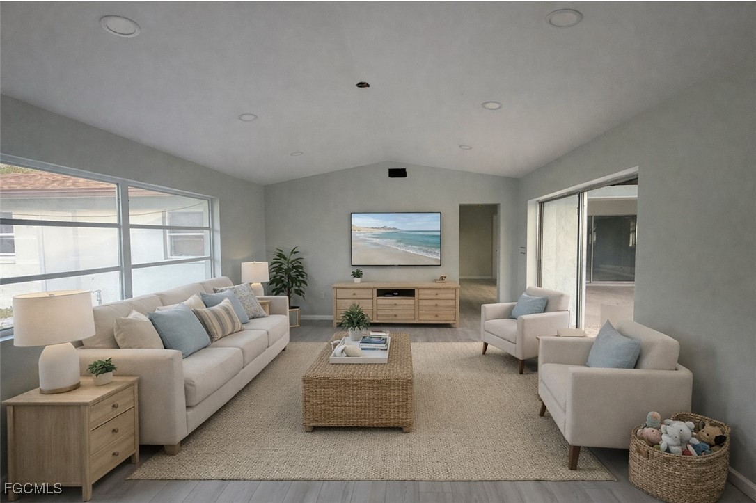 16320 Arbor Ridge Drive Fort Myers, FL 33908 - Photo 6 of 20 a living room with furniture and a large window