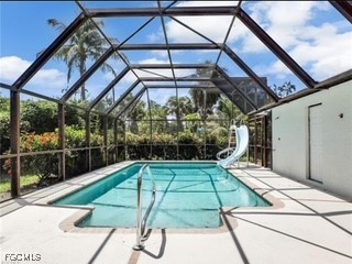 16320 Arbor Ridge Drive Fort Myers, FL 33908 - Photo 7 of 20 a view of a backyard with a patio and a table and chair