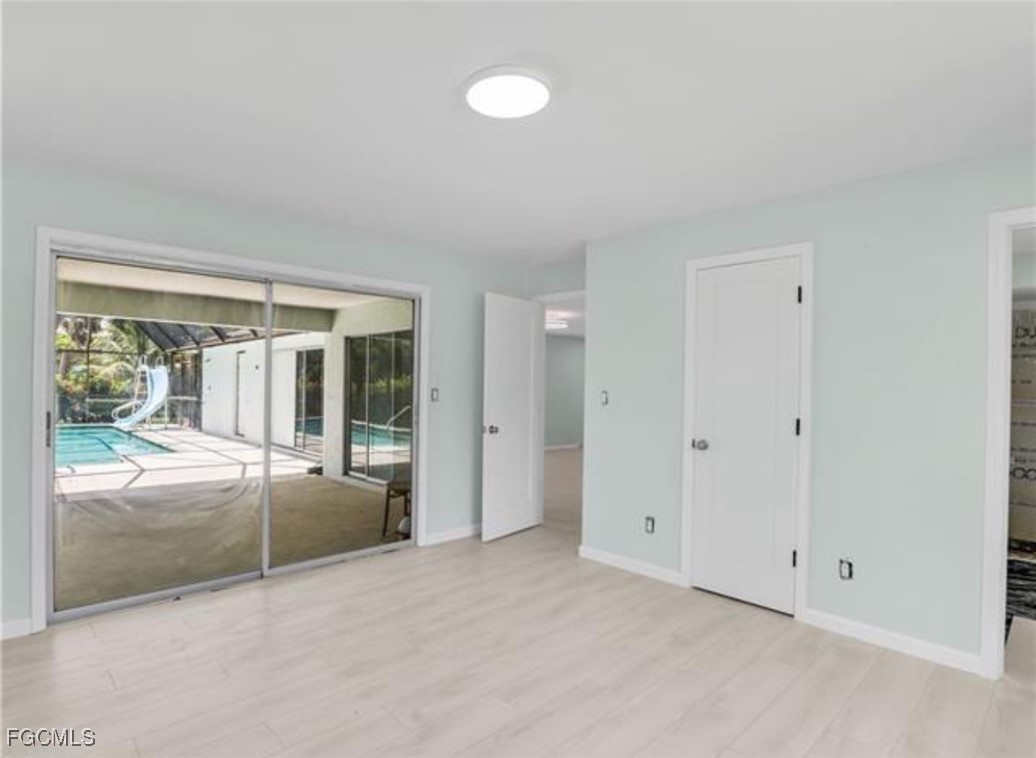 16320 Arbor Ridge Drive Fort Myers, FL 33908 - Photo 10 of 20 wooden floor and window in an empty room