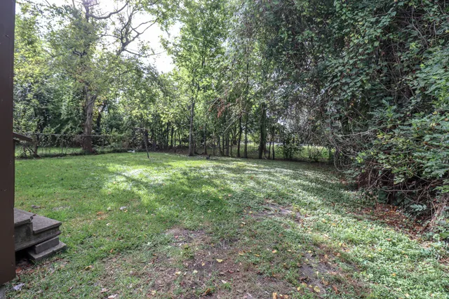a view of outdoor space with deck and yard