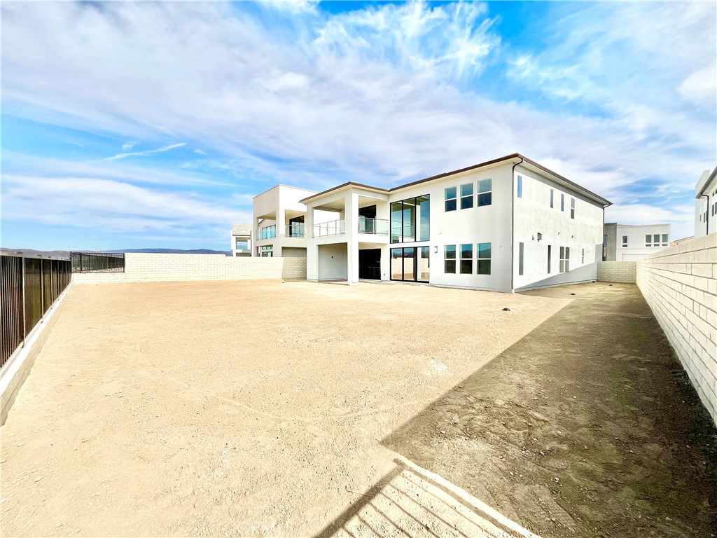 27565 Elderberry Drive Valencia, CA 91381 - Photo 34 of 36 a front view of a house with a yard