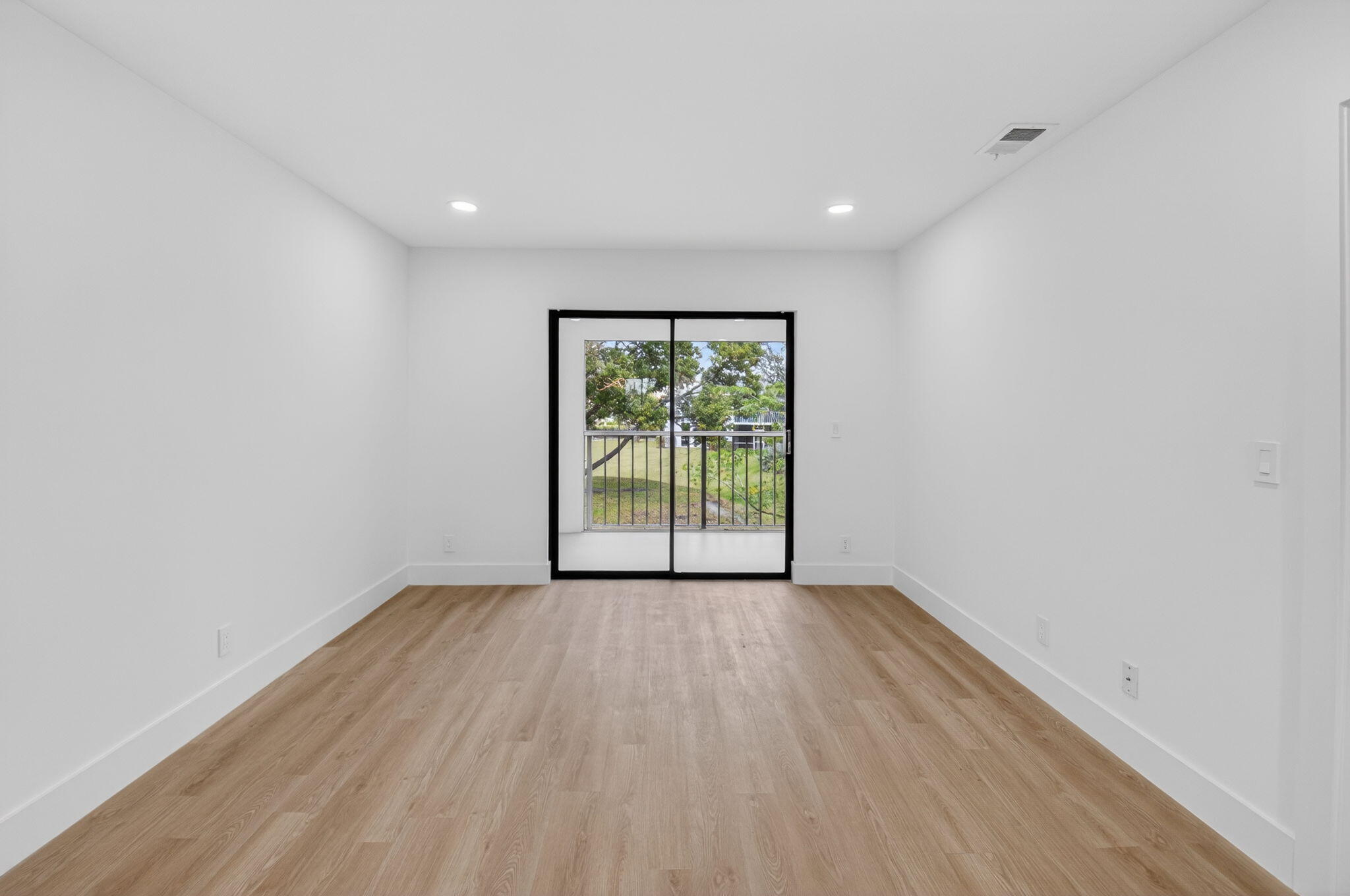 300 West Hidden Valley Boulevard, Unit 308 Boca Raton, FL 33487 - Photo 12 of 39 a view of empty room with wooden floor and fan