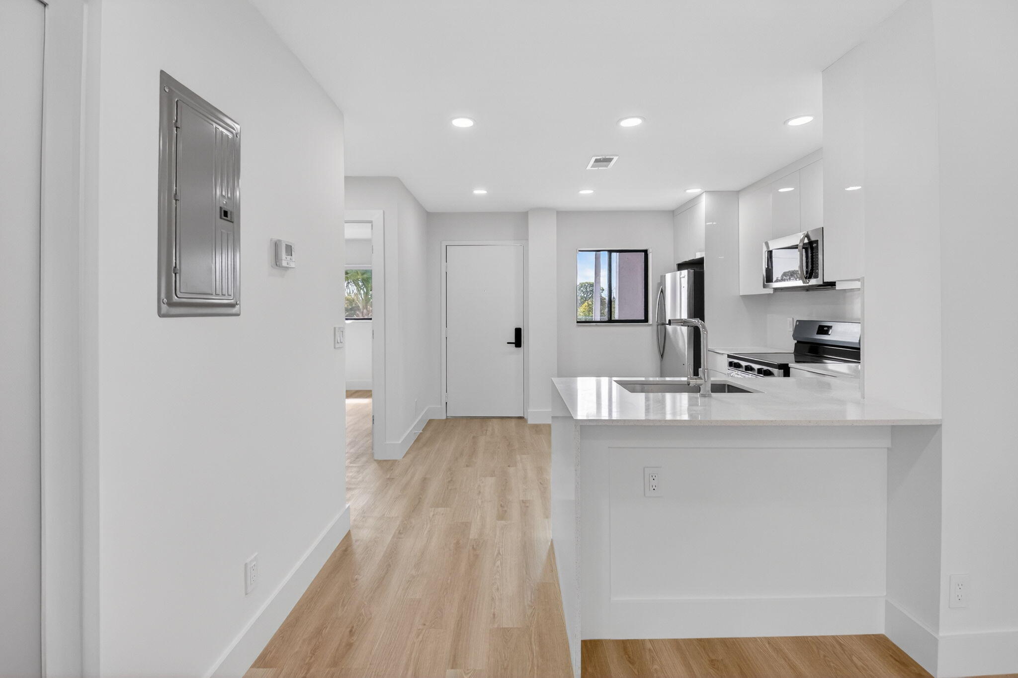 300 West Hidden Valley Boulevard, Unit 308 Boca Raton, FL 33487 - Photo 18 of 39 a kitchen with stainless steel appliances granite countertop a refrigerator and a sink