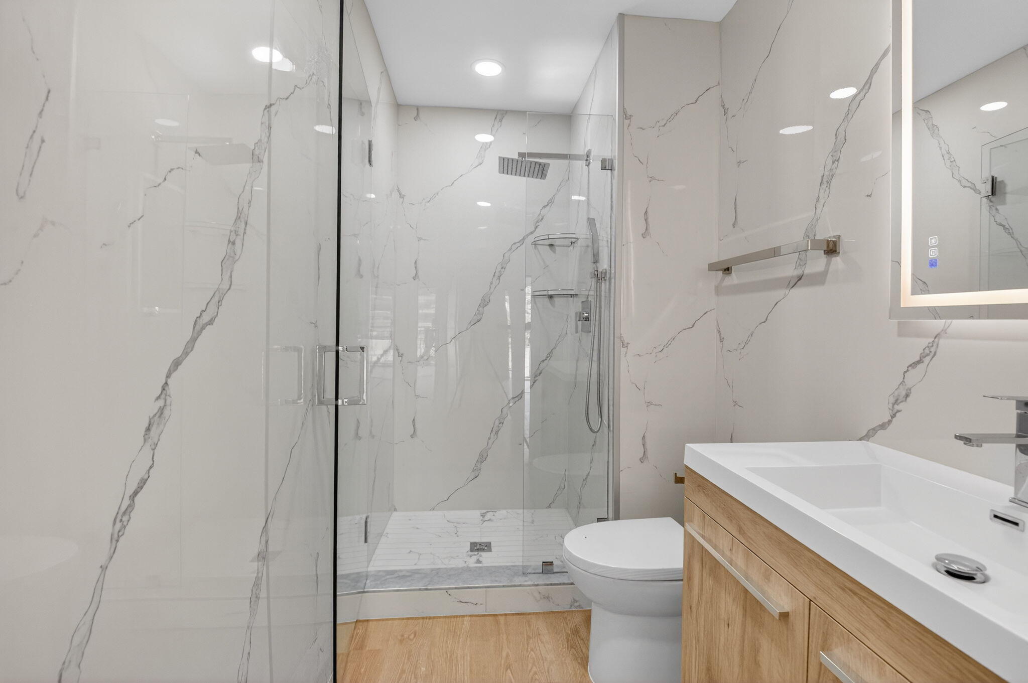 300 West Hidden Valley Boulevard, Unit 308 Boca Raton, FL 33487 - Photo 24 of 39 a bathroom with a sink toilet vanity and shower