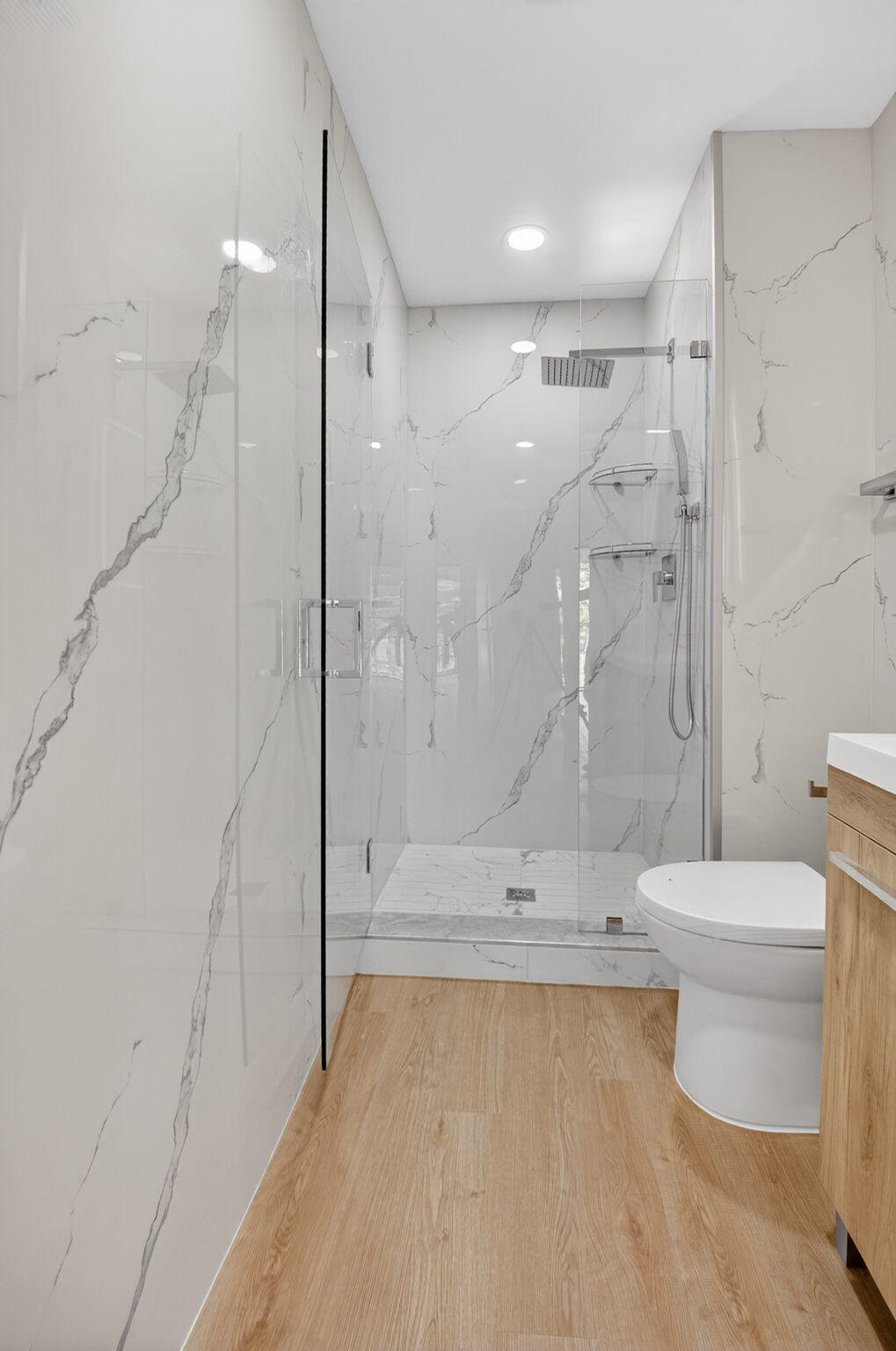 300 West Hidden Valley Boulevard, Unit 308 Boca Raton, FL 33487 - Photo 26 of 39 a bathroom with a toilet and a shower