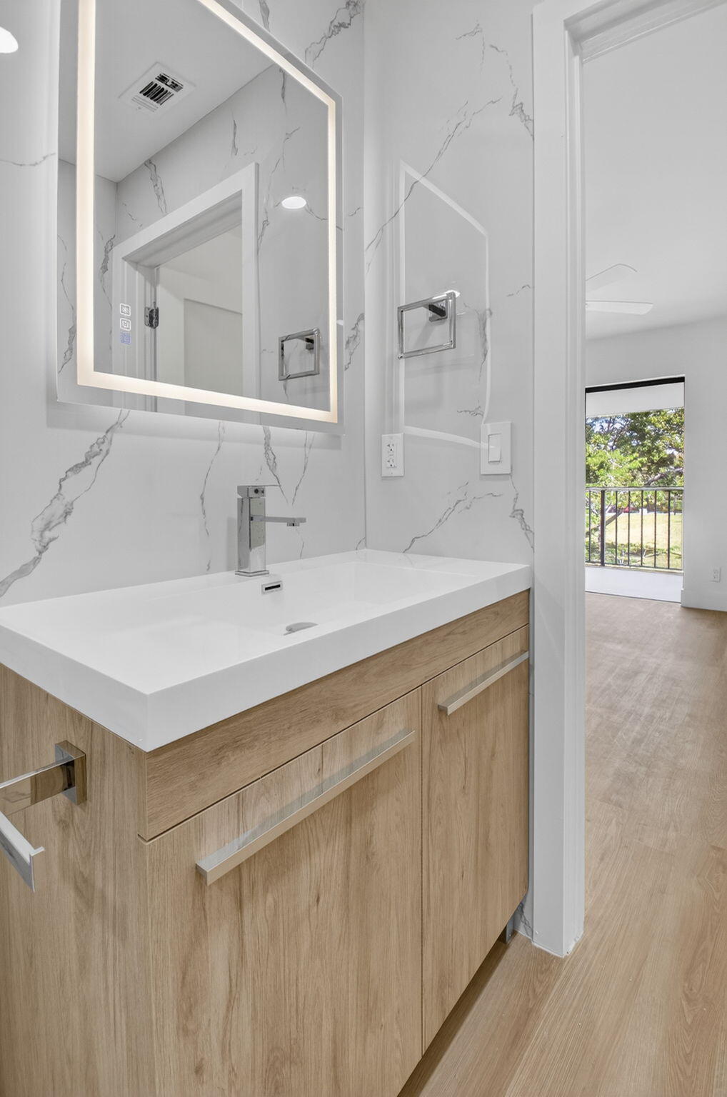 300 West Hidden Valley Boulevard, Unit 308 Boca Raton, FL 33487 - Photo 27 of 39 a bathroom with a sink and a mirror
