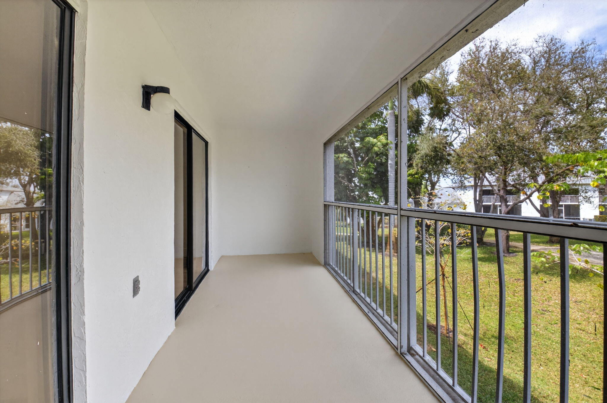 300 West Hidden Valley Boulevard, Unit 308 Boca Raton, FL 33487 - Photo 30 of 39 a view of a glass door and deck