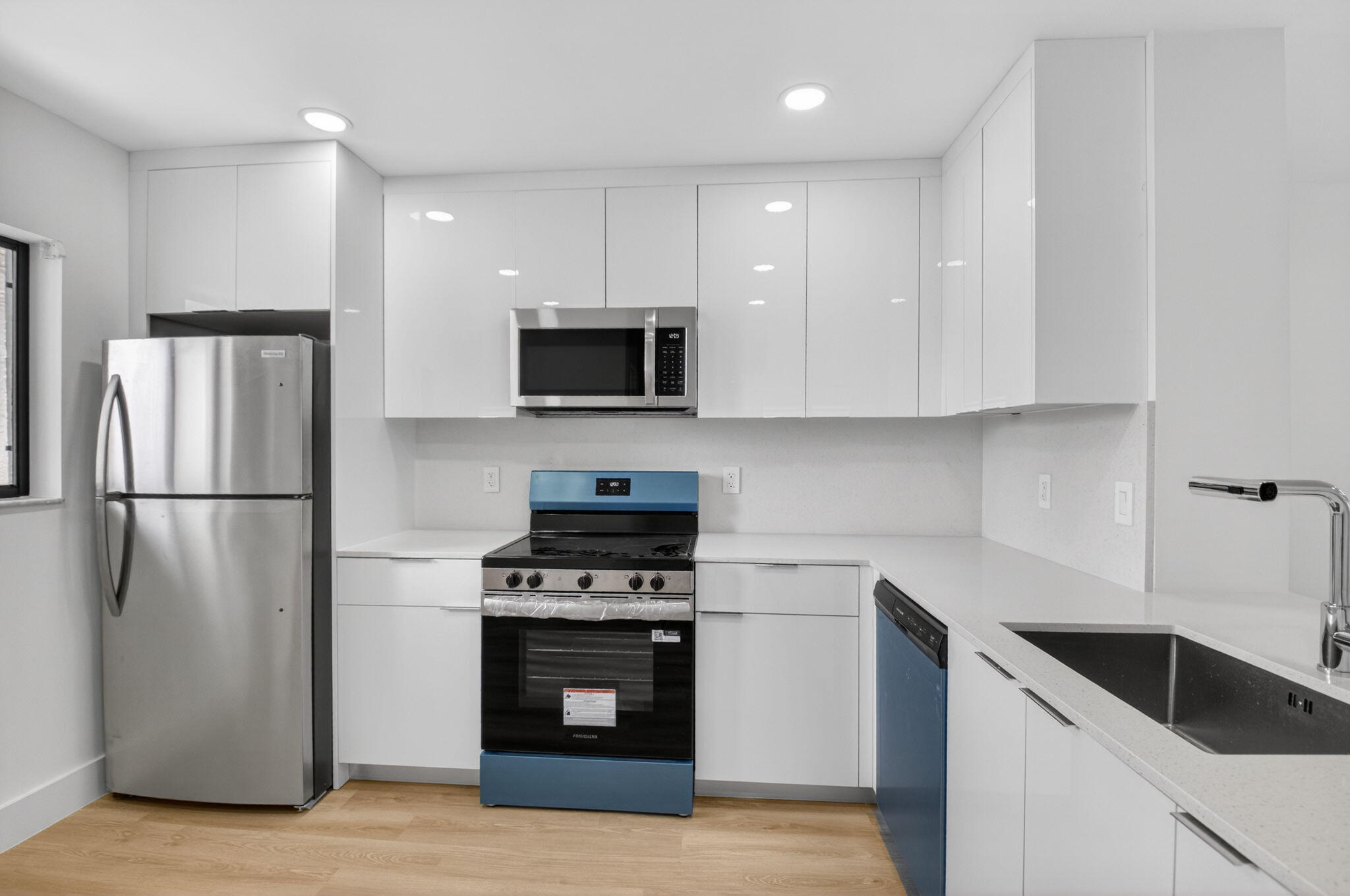 300 West Hidden Valley Boulevard, Unit 308 Boca Raton, FL 33487 - Photo 5 of 39 a kitchen with a refrigerator stove and microwave