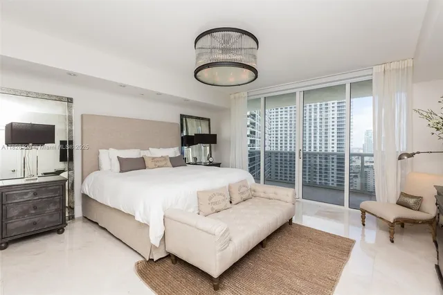 a spacious bathroom with a tub a sink and mirror